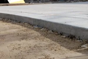 Concrete slab next to dirt
