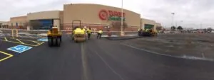 paving contractors working in grocery store parking lot