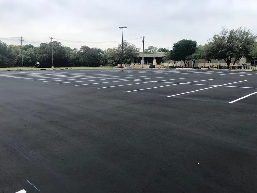 Read more about the article What Are The Pros and Cons of Sealcoating Your Asphalt Pavement?