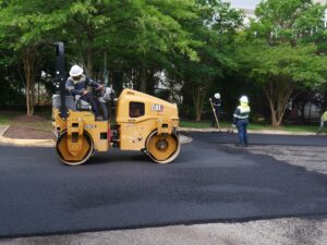 Workers paving asphalt