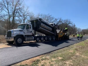 alpha paving truck laying concrete