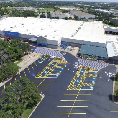aerial view of Commercial Property in Texas with fresh asphalt paving and line striping services