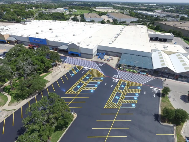 Commercial Property in Texas with fresh asphalt paving and line striping