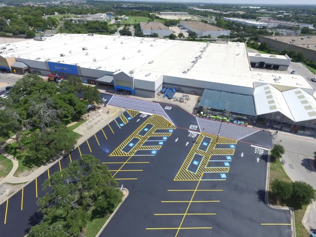 aerial view of Commercial Property in Texas with fresh asphalt paving and line striping services