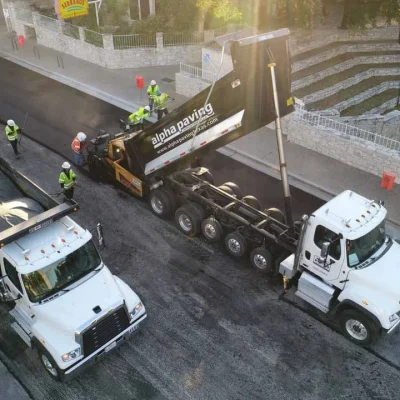 View of Top Texas Paving Company, Alpha Paving's Construction Trucks From Above