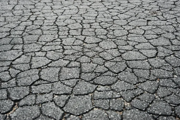 cracked asphalt road in need of asphalt crack filling