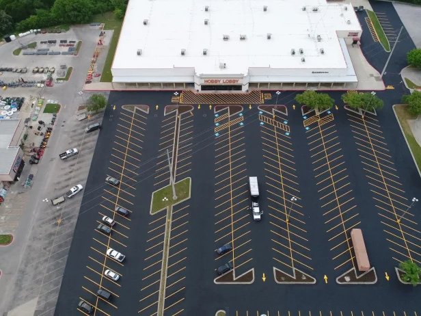 Aerial view of parking lot after sealcoating paving services